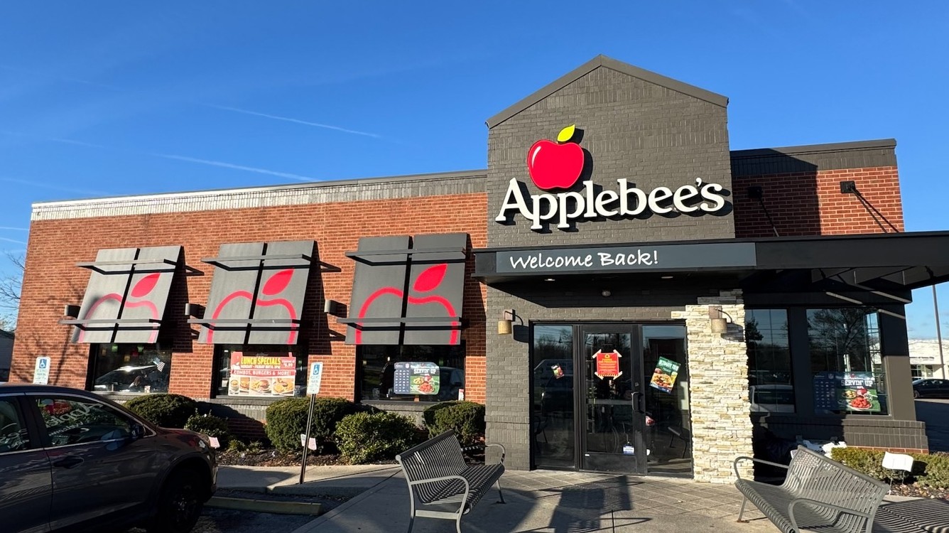 Applebee's storefront featuring branded awnings, a 'Welcome Back!' entrance canopy, and dimensional channel-letter signage.