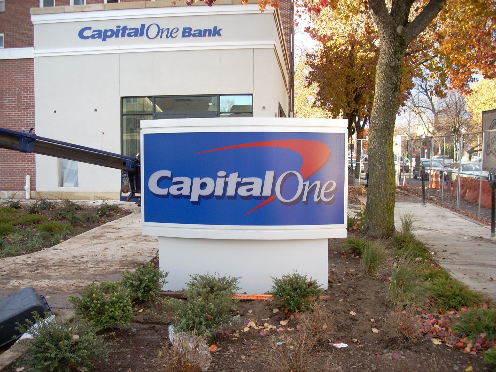 Freestanding bank monument sign in front of a branch building