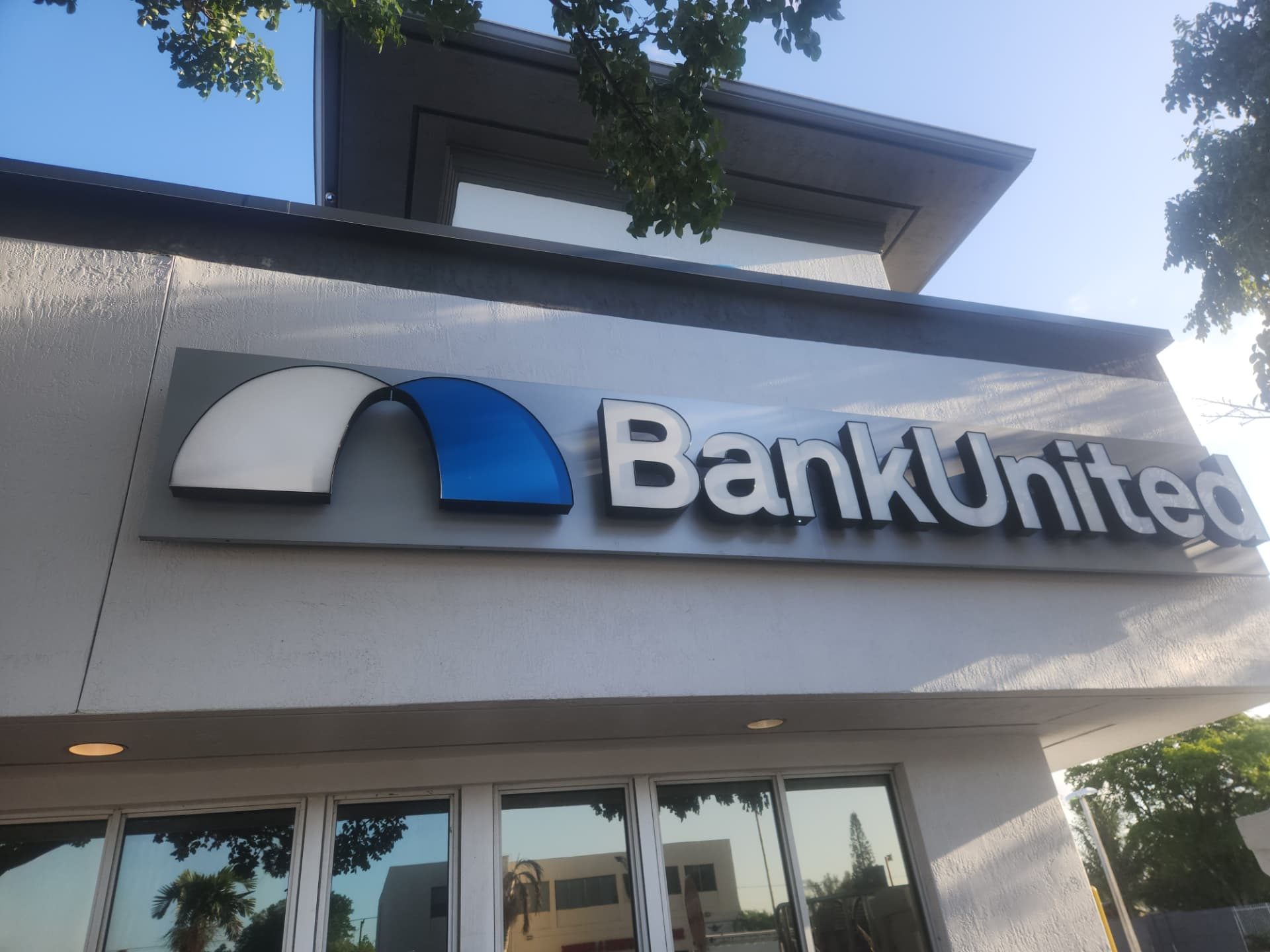 Dimensional bank identification signage on an exterior building fascia