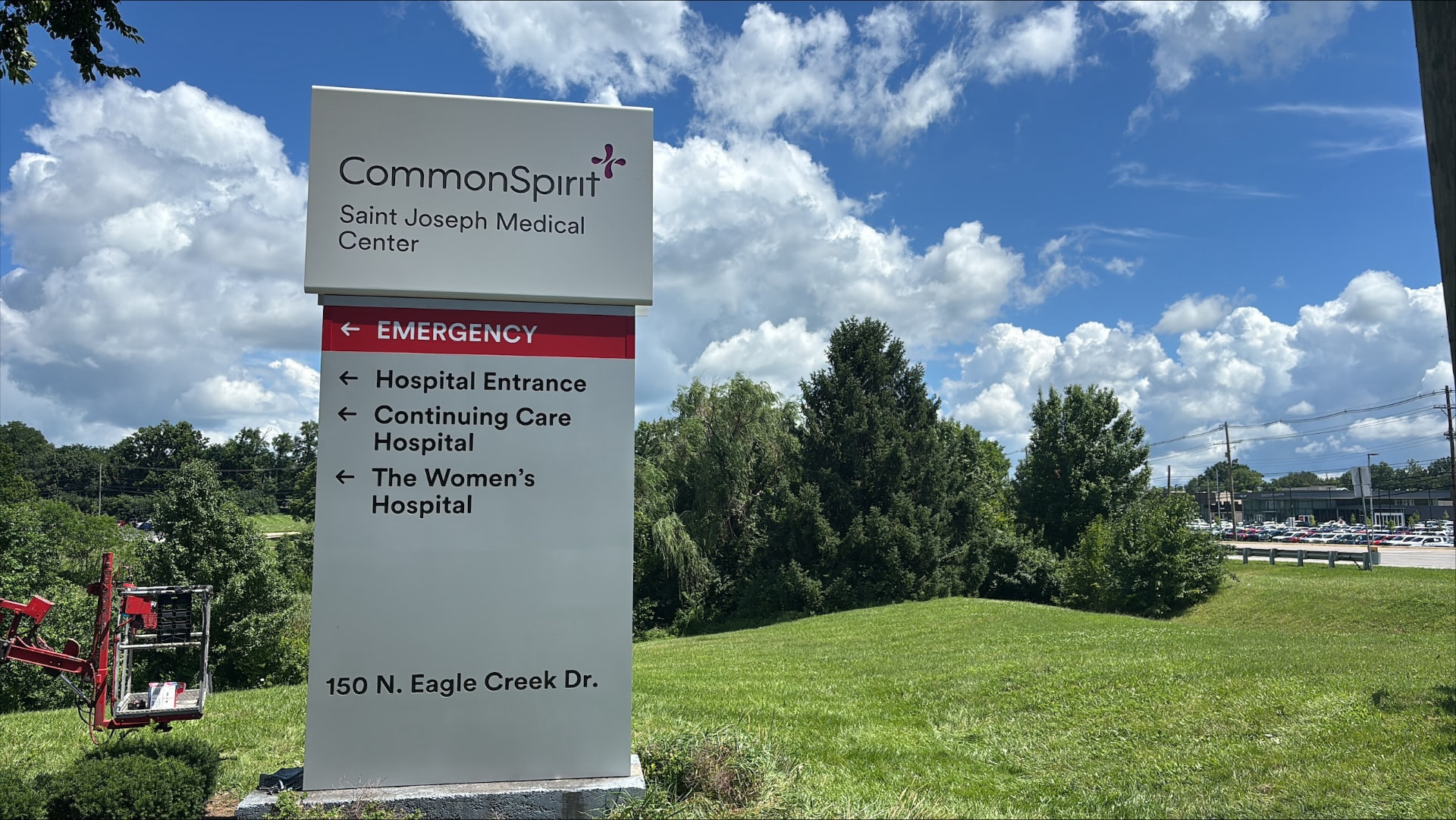 CommonSpirit Saint Joseph Medical Center white monument sign with emergency and wayfinding directory panels